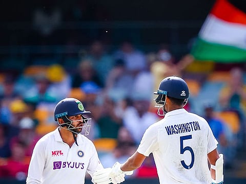 India's Washington Sundar (R) and Shardul Thakur during the fourth Test against Australia