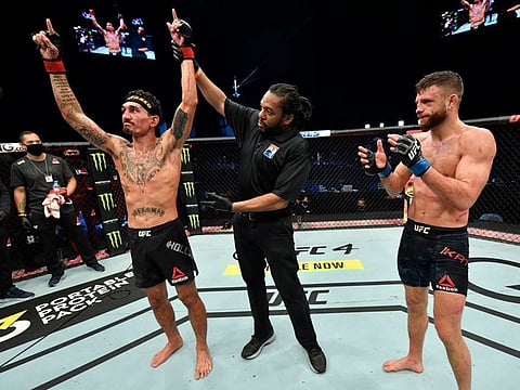 Max Holloway celebrates his win over Calvin Kattar in Abu Dhabi