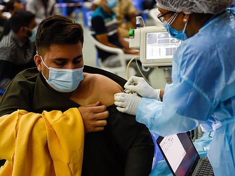 Residents getting COVID-19 Vaccine at Indian Association Ajman.