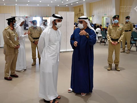 Sheikh Mansoor bin Mohammed tours a vaccination facility in Dubai.