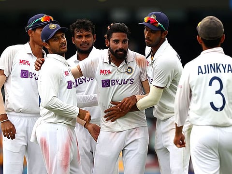 India's paceman Mohammed Siraj celebrates his fifth wicket against Australia