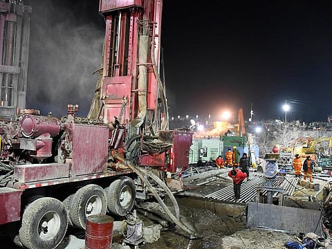 Rescuers drill a new channel at the explosion site of a gold mine in Qixia City, east China's Shandong Province, on January 18, 2021.