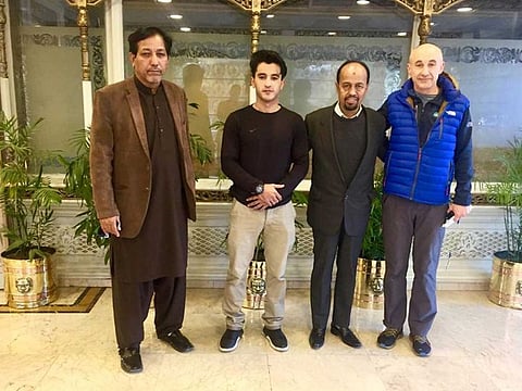 Alex Goldfarb poses for a photo with members of Alpine Club of Pakistan in Islamabad, Pakistan December 29, 2020.