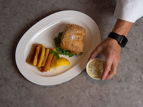Fish served with double-cooked chips, mushy peas and tartare sauce