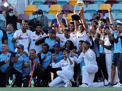 India celebrates their series win over Australia with the Border-Gavaskar trophy at the Gabba