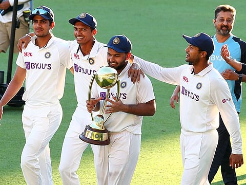 A moment to chrish: India's Rishabh Pant with the Border-Gavaskar Trophy as he celebrates with his teammates after defeating Australia by three wickets on the final day of the fourth Test at the Gabba, Brisbane. India won the series 2-1 to retain the trophy.