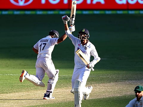 India's Rishabh Pant and Navdeep Saini celebrate victory over Australia at the Gabba in Brisbane