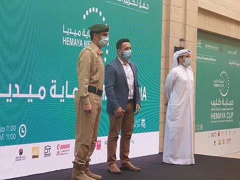 Gulf News senior reporter Ali Al Shouk (centre) at the Dubai Police Hemaya clip award ceremony in Dubai on Thursday. Gulf News was honoured for best media coverage of the Hemaya clip initiative in English language
