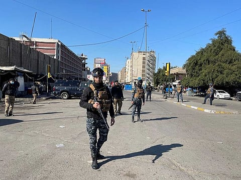 Iraqi security forces keep guard at the site of a suicide attack in Baghdad, Iraq January 21, 2021.