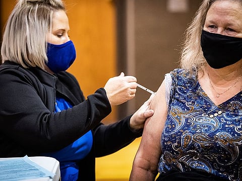 File picture: Crissy Jones administers a COVID-19 vaccination to Caren Haynes in Weatherford, Texas.