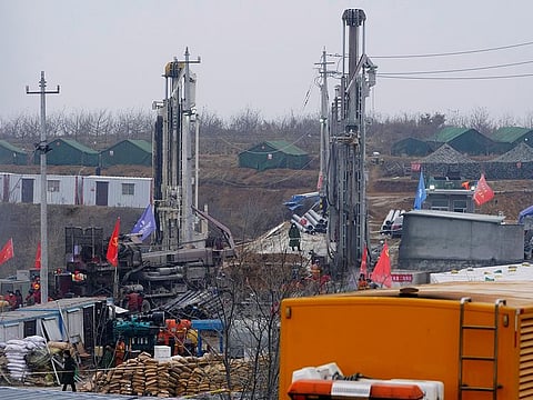 Rescuers work at the Hushan gold mine where workers were trapped underground after the Jauary 10 explosion, in Qixia, Shandong province.