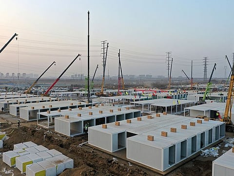 Workers build a large centralised quarantine facility capable of holding several thousand people in Shijiazhuang in northern China's Hebei Province.