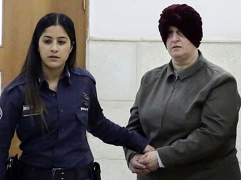 This February 27, 2018, file photo, shows Israeli-born Australian Malka Leifer, right, being brought to a courtroom in Jerusalem. Israel's Supreme Court on December 15, 2020, rejected an appeal challenging the extradition of Leifer, a former teacher wanted in Australia accused of sexually abusing several former students at a Jewish school in Melbourne.