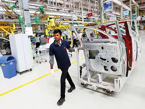 An employee works inside a Mahindra manufacturing plant in Chakan, Maharashtra.