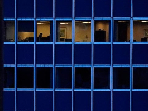 Employees work in an office building in Midtown New York City.