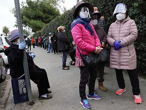 File picture: People wait to receive COVID-19 vaccine doses in Los Angeles, California.