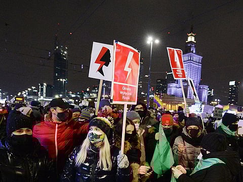 People protest against new anti-abortion laws near the ruling Law and Justice party headquarters in Warsaw, on January 29, 2021.