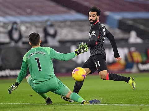 Liverpool's Mohamed Salah scores their second goal.