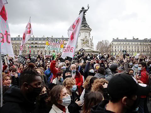People attend a demonstration against the 'Global Security Bill', that right groups say would make it a crime to circulate an image of a police officer's face and would infringe journalists' freedom in the country, in Paris, on January 30, 2021.