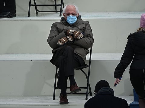 File photo: Senator Bernie Sanders sits in the bleachers on Capitol Hill before Joe Biden is sworn in as the 46th US President at the US Capitol in Washington, DC. A Vermont schoolteacher whose homemade mittens went viral after Sanders wore them at Biden's inauguration has found a manufacturer to fulfill the resulting thousands of orders for her cozy gloves.