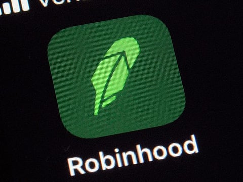 The logo for the Robinhood app on a smartphone.