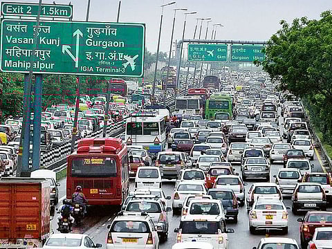 Cars seen stuck in traffic in New Delhi. More than 5,000 people died in pothole-related road deaths in two years.