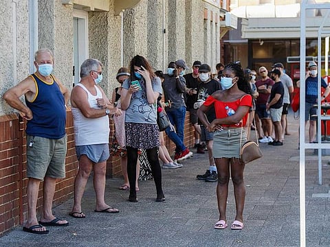 People wait in line to be tested for COVID-19 at Royal Perth Hospital in Perth on January 31, 2021.