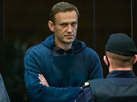 Alexei Navalny stands inside a glass cell during a court hearing in Moscow on February 2, 2021.