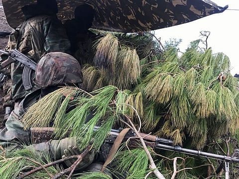 Algerian soldiers take positions during an operation against militants, in the Ain Defla mountains, west of the capital Algiers, Algeria January 26, 2021.