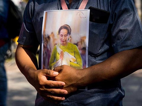 A protester holds an image of Aung San Suu Kyi outside the United Nations building in Bangkok during a demonstration against the military coup in Myanmar