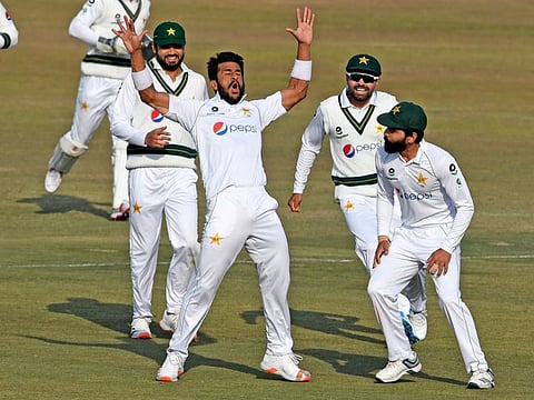 Pakistan fast bowler Hasan Ali (centre) celebrates with his teammates after dismissing South Africa's Rassie van der Dussen (not pictured) during the second day of the second Test in Rawalpindi on Friday.