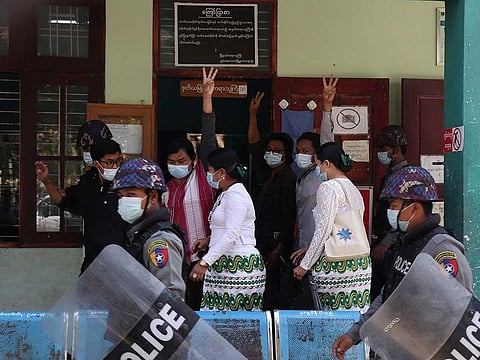 Students arrive at a court after being arrested in a demonstration against the military coup, in Mandalay, Myanmar, February 5, 2021.