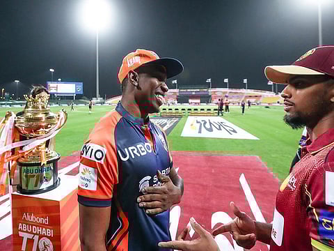 Caribbean flavour: Nicholas Pooran (right), the winning captain of Northern Warriors, has a laugh with Delhi Bulls captain Dwayne Bravo ahead of the Alubond Abu Dhabi T10 final.