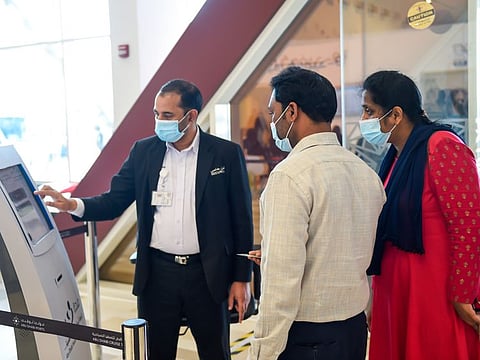 Visitors receiving token on their arrival for Vaccine at SEHA COVID-19 Vaccination Center, Mina Rashed in Abu Dhabi. Photo: Virendra Saklani/Gulf News