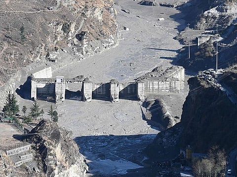 A general view shows the remains of a dam along a river in Tapovan of Chamoli district on February 8, 2021 damaged after a flash flood thought to have been caused when a glacier broke off on February 7.