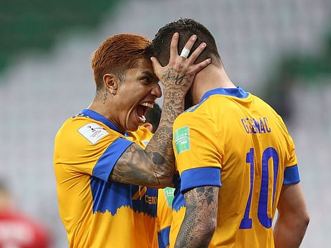 Tigres' Andre-Pierre Cignac Carlos Salcedo celebrate during the Club World Cup semifinal against Brazil's Palmeiras.