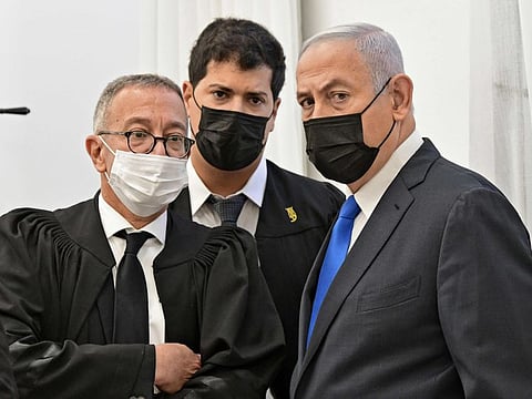 Israeli Prime Minister Benjamin Netanyahu looks on during a hearing in his corruption trial at the Jerusalem district court, on February 8, 2021.