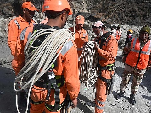National Disaster Response Force personnel prepare for a rescue operation near a tunnel blocked with mud and debris in Tapovan of Chamoli district on February 9, 2021 following a flash flood thought to have been caused when a glacier burst on February 7.