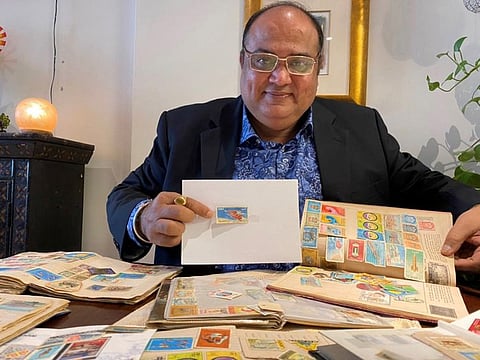Nandlal Hiranand Mirchandani with the space stamp series issued by Sheikh Rashid in 1964.