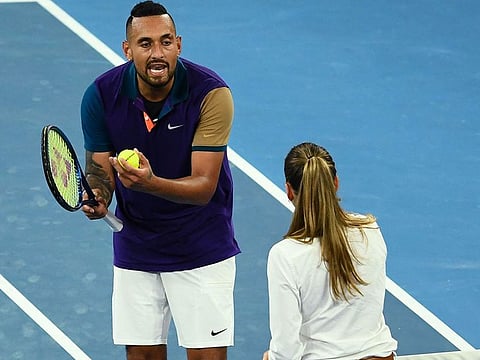 Australia's Nick Kyrgios talks to the umpire as he plays against France's Ugo Humbert during their men's singles match on day three of the Australian Open