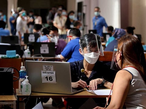 Health workers and employees of Philippine General Hospital register for COVID-19 vaccination, expected to arrive this month, in Manila, Philippines. Photo taken on February 9, 2021. About 80% of manufacturing capacity of leading vaccine makers in the West, estimated at 4.4 billion doses this 2021, had been pre-booked for 15% of global population.