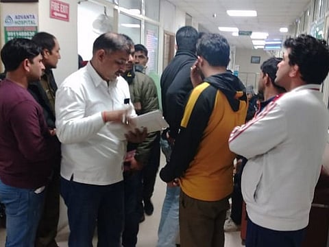 Police officials at a hospital after five people died at Mehar Singh Akhada in a firing incident, in Rohtak.