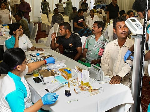 Workers getting their blood glucose and blood pressure checked at a health awareness camp by medical wing of Pakistan Association of Dubai. Photo for illustrative purpose only.