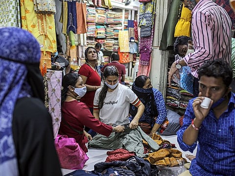 Customer browse fabrics inside Mangaldas Market in Mumbai.