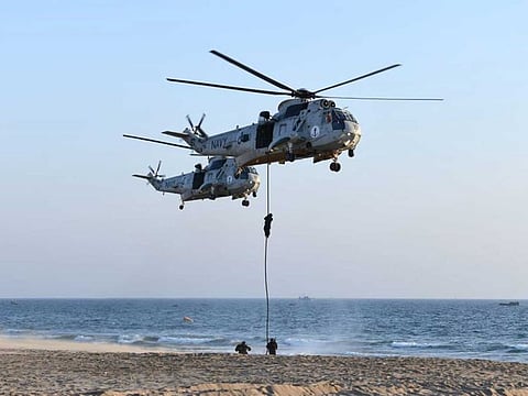 Pakistan Navy SEALs taking part in counter-terrorism drills at PNS Qasim, Manora, as part of the multinational maritime exercise Aman-21 in the Arabian Sea.