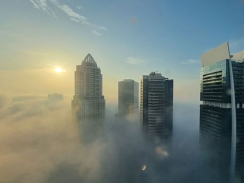Dense foggy morning in Jumeirah Lakes Towers Dubai