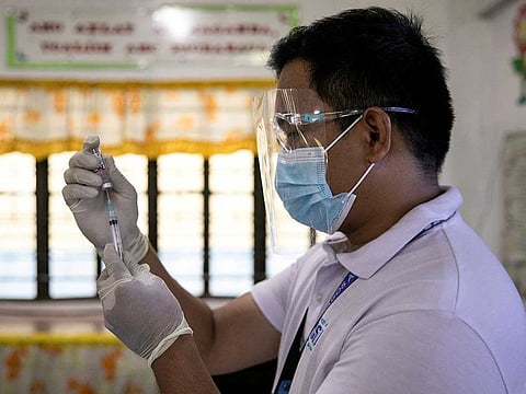A health worker participates in a simulation for COVID-19 vaccination in preparation for its arrival, at an elementary school turned vaccination command center in Pasig City, Metro Manila, Philippines.