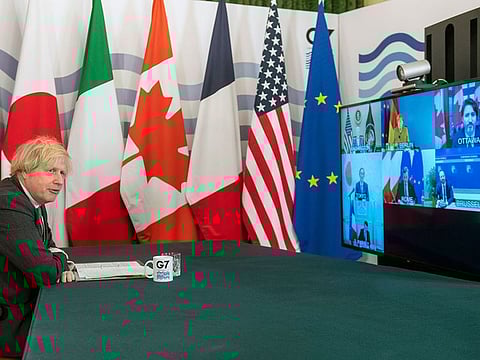 Britian's Prime Minister Boris Johnson hosts a virtual meeting of G7 world leaders, from within the Cabinet Room at Downing Street in London, Friday Feb. 19, 2021.