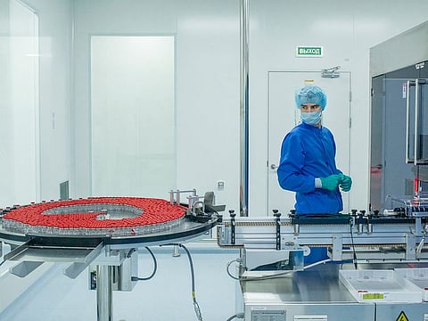 An employee oversees a Sputnik V vaccine production line operated by a contractor, the pharmaceutical company Biocad, in Saint Petersburg.