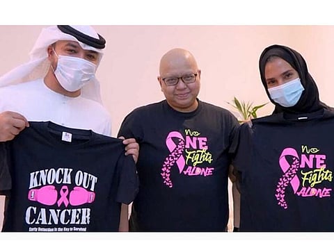 Maria Vizcaya sells T-shirts with a special message hand-painted by her.